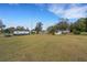 Spacious backyard with ample room for recreation and relaxation, complemented by a well-maintained lawn at 4380 Turner Rd, Mulberry, FL 33860