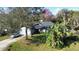 House with a spacious yard and palm trees. Located in a quiet neighborhood at 4419 Burlington Dr, Winter Haven, FL 33880