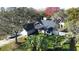 Single-Gathering home nestled among lush trees and landscaping at 4419 Burlington Dr, Winter Haven, FL 33880