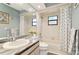 Clean bathroom with a single sink vanity and tub shower combo at 4419 Burlington Dr, Winter Haven, FL 33880