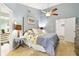 Main bedroom with ceiling fan and access to bathroom at 4419 Burlington Dr, Winter Haven, FL 33880