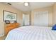 Spacious bedroom with striped bedding and ample storage at 4419 Burlington Dr, Winter Haven, FL 33880