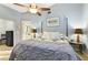 Comfortable main bedroom with ceiling fan and ensuite bathroom at 4419 Burlington Dr, Winter Haven, FL 33880