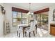 Charming dining room with wood table and access to backyard at 4419 Burlington Dr, Winter Haven, FL 33880