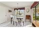 Bright dining area with wood table and views to the backyard at 4419 Burlington Dr, Winter Haven, FL 33880