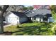 Single-Gathering home with a two-car garage and a well-manicured lawn at 4419 Burlington Dr, Winter Haven, FL 33880