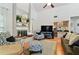 Bright living room featuring a fireplace and wet bar at 4419 Burlington Dr, Winter Haven, FL 33880