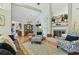 Bright living room with hardwood floors, fireplace and seating at 4419 Burlington Dr, Winter Haven, FL 33880