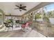 Relaxing screened patio with wicker furniture and ceiling fan at 4419 Burlington Dr, Winter Haven, FL 33880