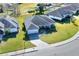 An aerial view showcasing a house with a gray roof and a paved driveway at 4434 Micanope Crescent Dr, Lakeland, FL 33811