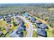 Aerial view of a single-Gathering home in a residential neighborhood at 4434 Micanope Crescent Dr, Lakeland, FL 33811