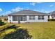 The property boasts a spacious backyard with a screened patio at 4434 Micanope Crescent Dr, Lakeland, FL 33811