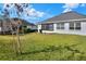 Large backyard with screened patio, providing ample outdoor space at 4434 Micanope Crescent Dr, Lakeland, FL 33811