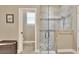 Modern bathroom with a walk-in shower and pebble floor at 4434 Micanope Crescent Dr, Lakeland, FL 33811