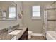 Bathroom with granite countertop, bathtub and shower combo at 4434 Micanope Crescent Dr, Lakeland, FL 33811