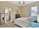 Bedroom with a full-sized bed and an ensuite bathroom at 4434 Micanope Crescent Dr, Lakeland, FL 33811