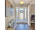 Bright entryway with a bench, large artwork, and a view of the interior at 4434 Micanope Crescent Dr, Lakeland, FL 33811