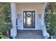Elegant front entrance with decorative glass door and stone accents at 4434 Micanope Crescent Dr, Lakeland, FL 33811