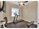 Home gym with treadmill, weight bench, and flooring at 4434 Micanope Crescent Dr, Lakeland, FL 33811
