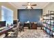 Spacious home office with built-in shelving and L-shaped desk at 4434 Micanope Crescent Dr, Lakeland, FL 33811