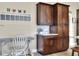 Kitchen with ample cabinetry and a built-in desk area at 4434 Micanope Crescent Dr, Lakeland, FL 33811