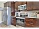 Modern kitchen with stainless steel appliances and granite countertops at 4434 Micanope Crescent Dr, Lakeland, FL 33811