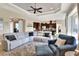 Open floor plan living room with sectional sofa and view of kitchen at 4434 Micanope Crescent Dr, Lakeland, FL 33811