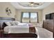 Bright main bedroom with king-size bed, large windows, and ample natural light at 4434 Micanope Crescent Dr, Lakeland, FL 33811