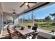 Screened in porch with backyard view and ceiling fans at 4434 Micanope Crescent Dr, Lakeland, FL 33811