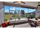 Screened porch with patio furniture and view of backyard at 4434 Micanope Crescent Dr, Lakeland, FL 33811