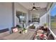 Screened porch with dining table and access to backyard at 4434 Micanope Crescent Dr, Lakeland, FL 33811