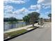 Neighborhood street showcasing well-maintained sidewalks and picturesque waterfront views at 4434 Micanope Crescent Dr, Lakeland, FL 33811