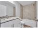 Bathroom with granite countertop and bathtub at 460 N 1St Ave, Bartow, FL 33830
