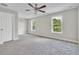 Spacious bedroom with carpet and large windows at 460 N 1St Ave, Bartow, FL 33830