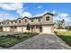 Three-unit townhome building with garage and landscaping at 460 N 1St Ave, Bartow, FL 33830