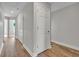 Hallway with wood-look floors and access to bedrooms at 460 N 1St Ave, Bartow, FL 33830