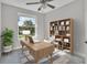 Home office features built-in shelving and large window at 460 N 1St Ave, Bartow, FL 33830