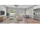 Open living room and kitchen with hardwood floors at 460 N 1St Ave, Bartow, FL 33830