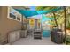 View of the back porch, complete with grill and steps leading up to the house at 531 Hunter St, Lakeland, FL 33803