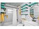 Stylish bathroom featuring a tub with shower and tile floors at 531 Hunter St, Lakeland, FL 33803