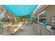 Charming deck with shade cover, outdoor seating and built in cabinets at 531 Hunter St, Lakeland, FL 33803
