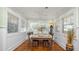 Charming dining room with natural light, beadboard walls, and hardwood floors at 531 Hunter St, Lakeland, FL 33803