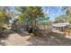 Exterior shot of house and yard, including shed, side porch, and off-street parking at 531 Hunter St, Lakeland, FL 33803