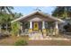 Charming home with a welcoming porch, colorful planters, and well-maintained landscaping at 531 Hunter St, Lakeland, FL 33803