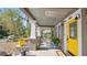 Charming front porch with rocking chair, yellow accents, and a welcoming entrance at 531 Hunter St, Lakeland, FL 33803