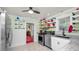 Kitchen featuring stainless steel appliances, granite countertops, and decorative shelving with colorful dishware at 531 Hunter St, Lakeland, FL 33803