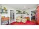 Inviting living area with open doorway, shelves, and beadboard walls at 531 Hunter St, Lakeland, FL 33803