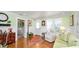 Comfortable living room with wood floors and view to the bedroom at 531 Hunter St, Lakeland, FL 33803