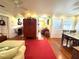 Open-concept living room with hardwood floors, ceiling fans, and views into other rooms at 531 Hunter St, Lakeland, FL 33803