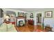 Living room features hardwood floors, fireplace, and view to multiple rooms at 531 Hunter St, Lakeland, FL 33803